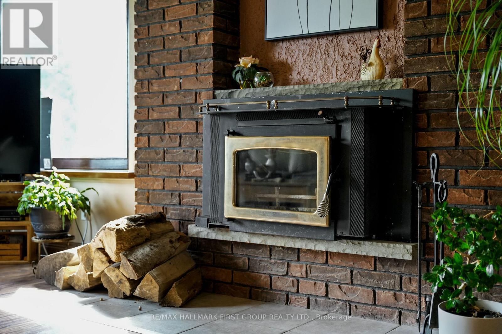 9950 Danforth Road E, Alnwick/Haldimand, ON - Indoor Photo Showing Other Room With Fireplace