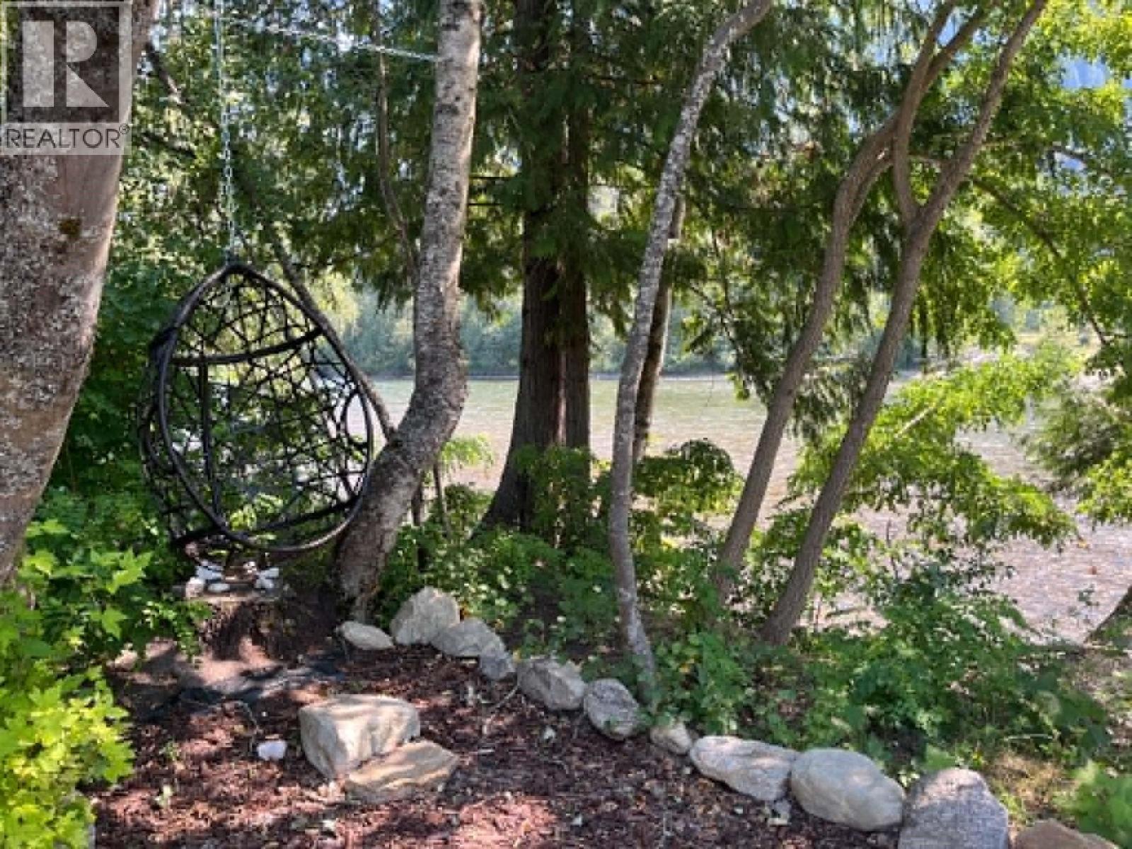 Egg chair to relax in while you view the river. - 3045 Bower Road, Slocan Park, BC