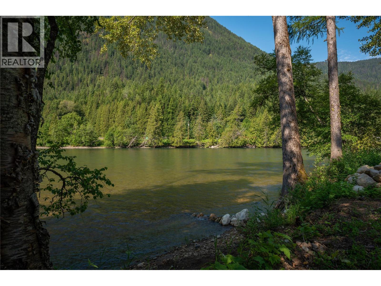 Slocan River view from the beach towards Slocan Park Bridge. - 3045 Bower Road, Slocan Park, BC