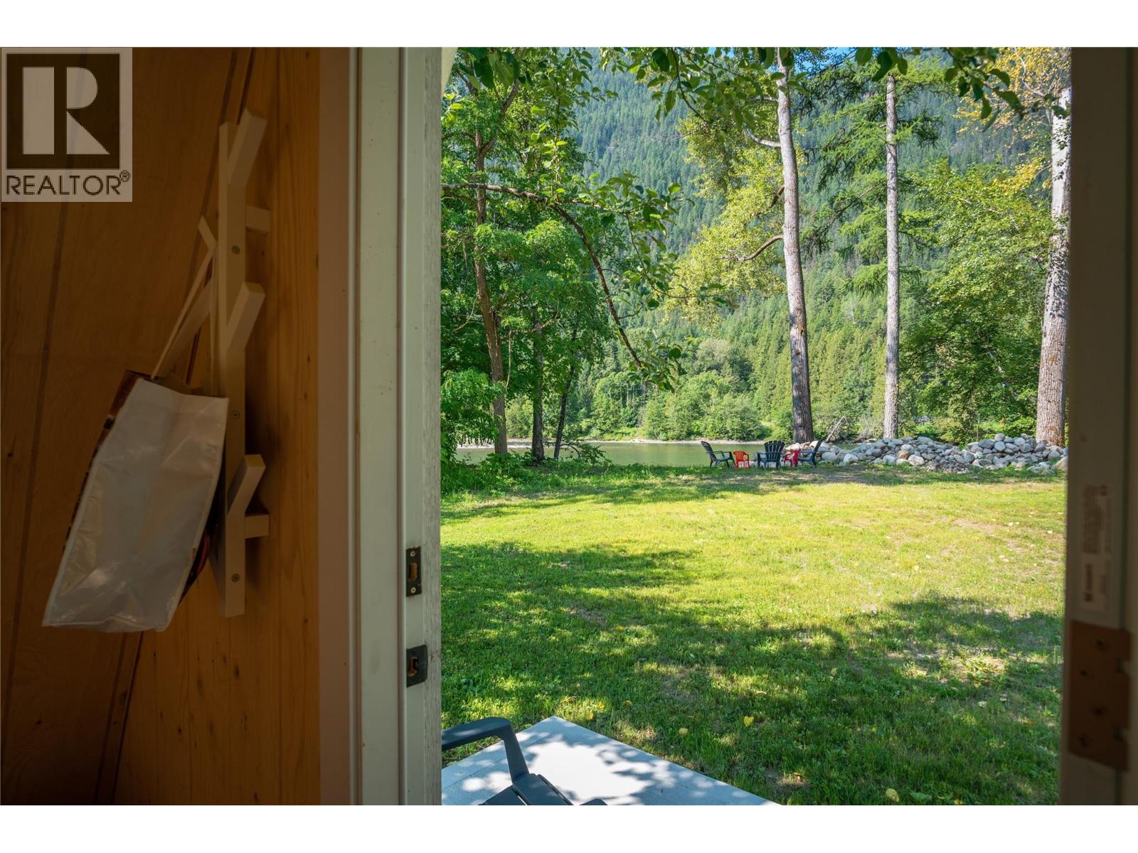View from inside the A-Frame towards the river. - 3045 Bower Road, Slocan Park, BC
