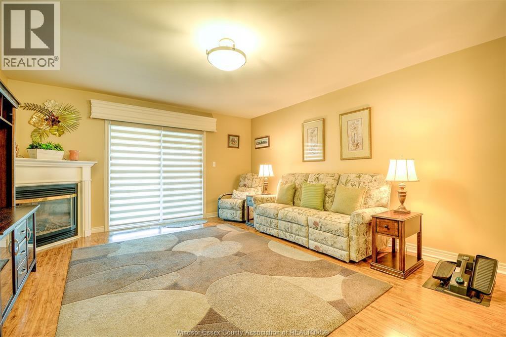 81 Crosswinds, Kingsville, ON - Indoor Photo Showing Living Room With Fireplace