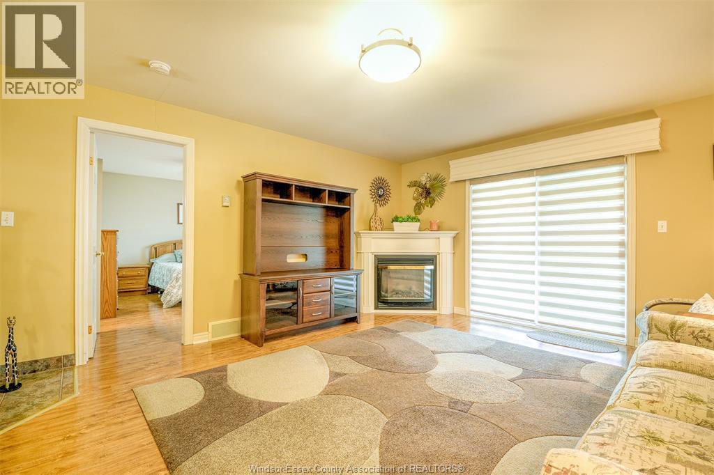81 Crosswinds, Kingsville, ON - Indoor Photo Showing Living Room With Fireplace