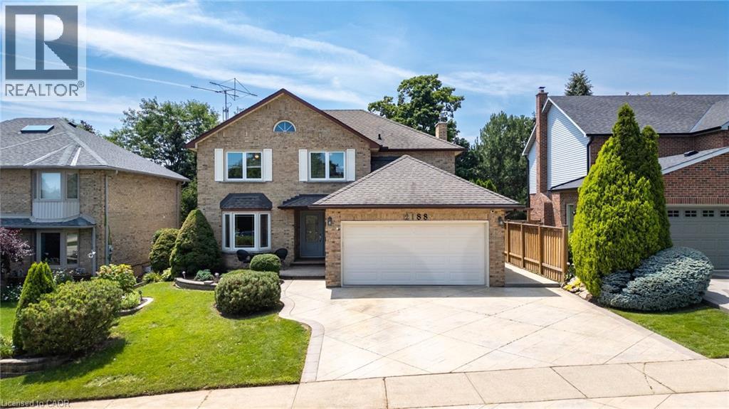 Traditional brick exterior with a large two-car garage - 2188 Bader Crescent, Burlington, ON - Outdoor With Facade