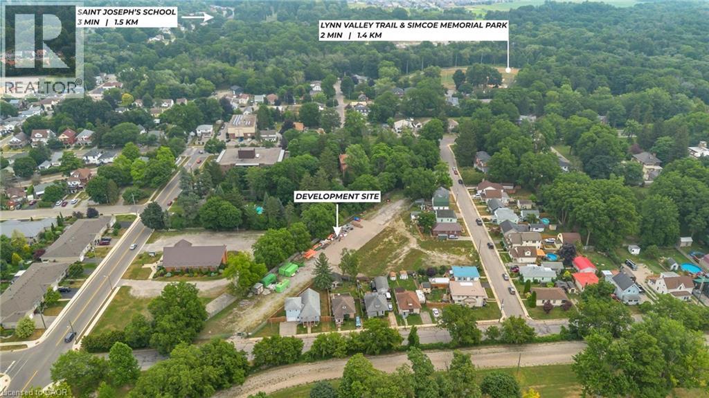 Aerial overview of a development site surrounded by established residential areas and mature tree cover - 9 James Street, Simcoe, ON
