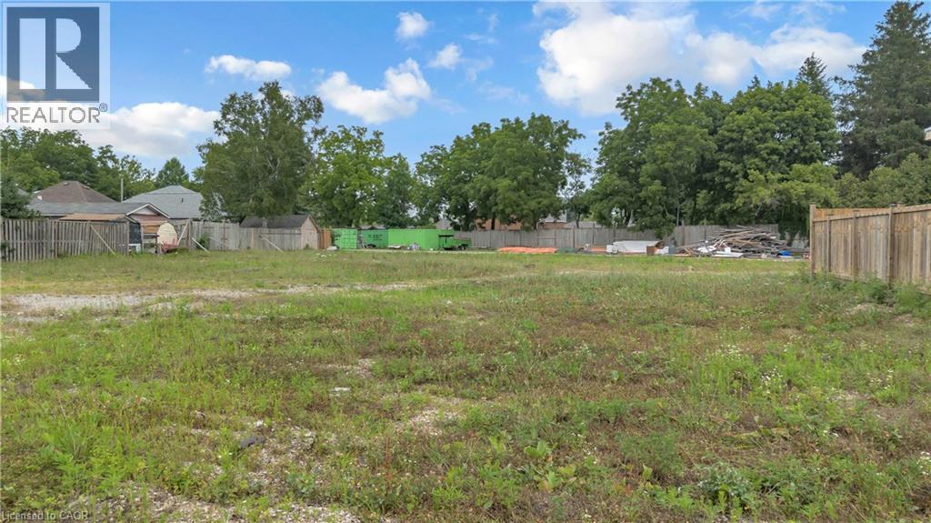 Expansive, level lot featuring mature perimeter trees and partial fencing - 9 James Street, Simcoe, ON