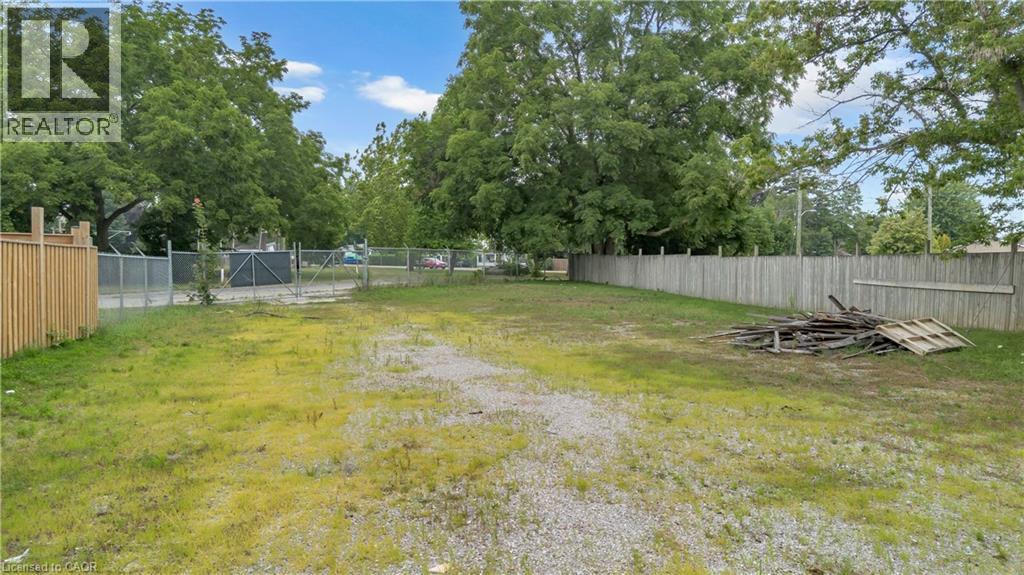 Expansive lot with a combination of gravel and grassy areas - 9 James Street, Simcoe, ON