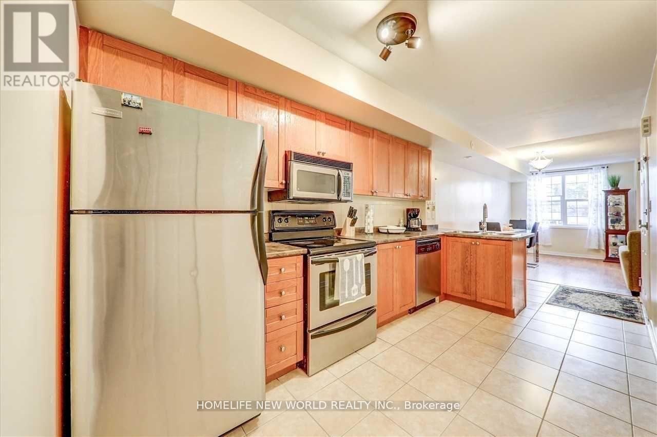 204 - 35 Strangford Lane, Toronto, ON - Indoor Photo Showing Kitchen With Double Sink