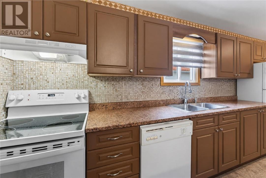 3066 River Road, Val Caron, ON - Indoor Photo Showing Kitchen With Double Sink