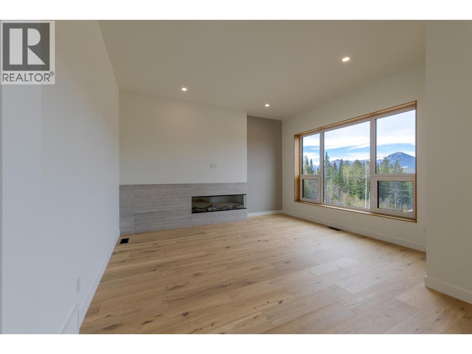1654 Howse Pass, Golden, BC - Indoor With Fireplace