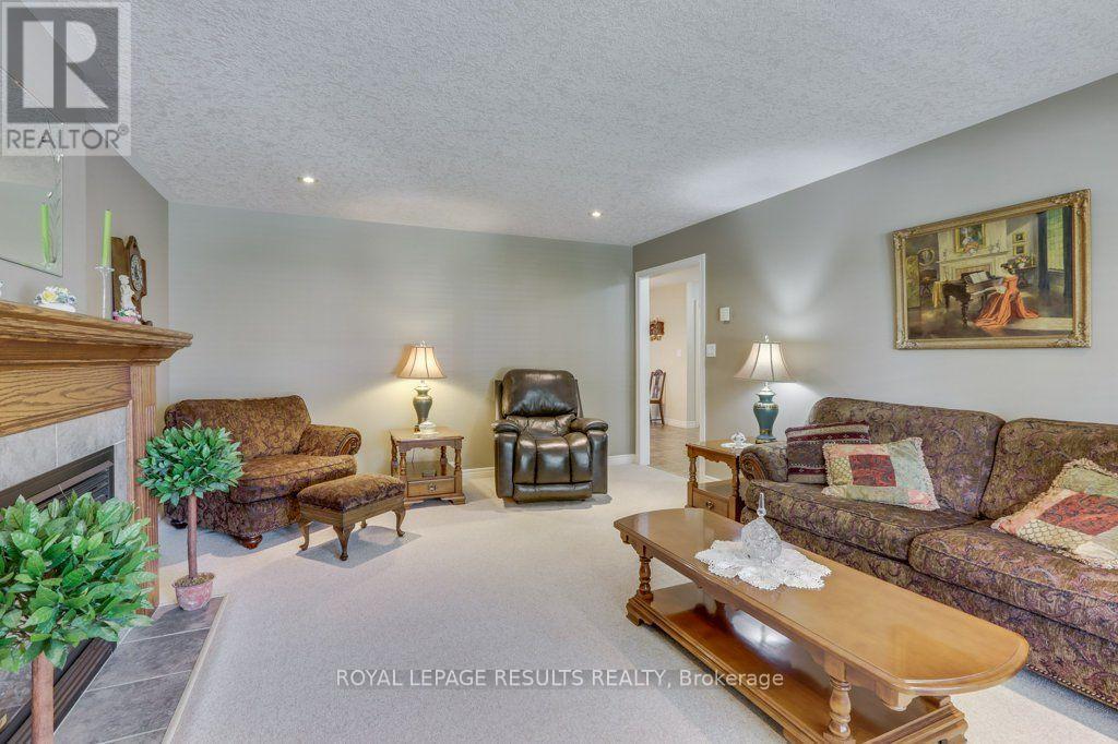 126 Glendale Drive, Tillsonburg, ON - Indoor Photo Showing Living Room With Fireplace