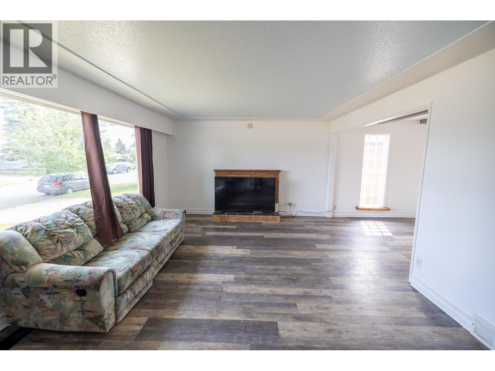 133 S Moffat Street, Prince George, BC - Indoor Photo Showing Living Room With Fireplace