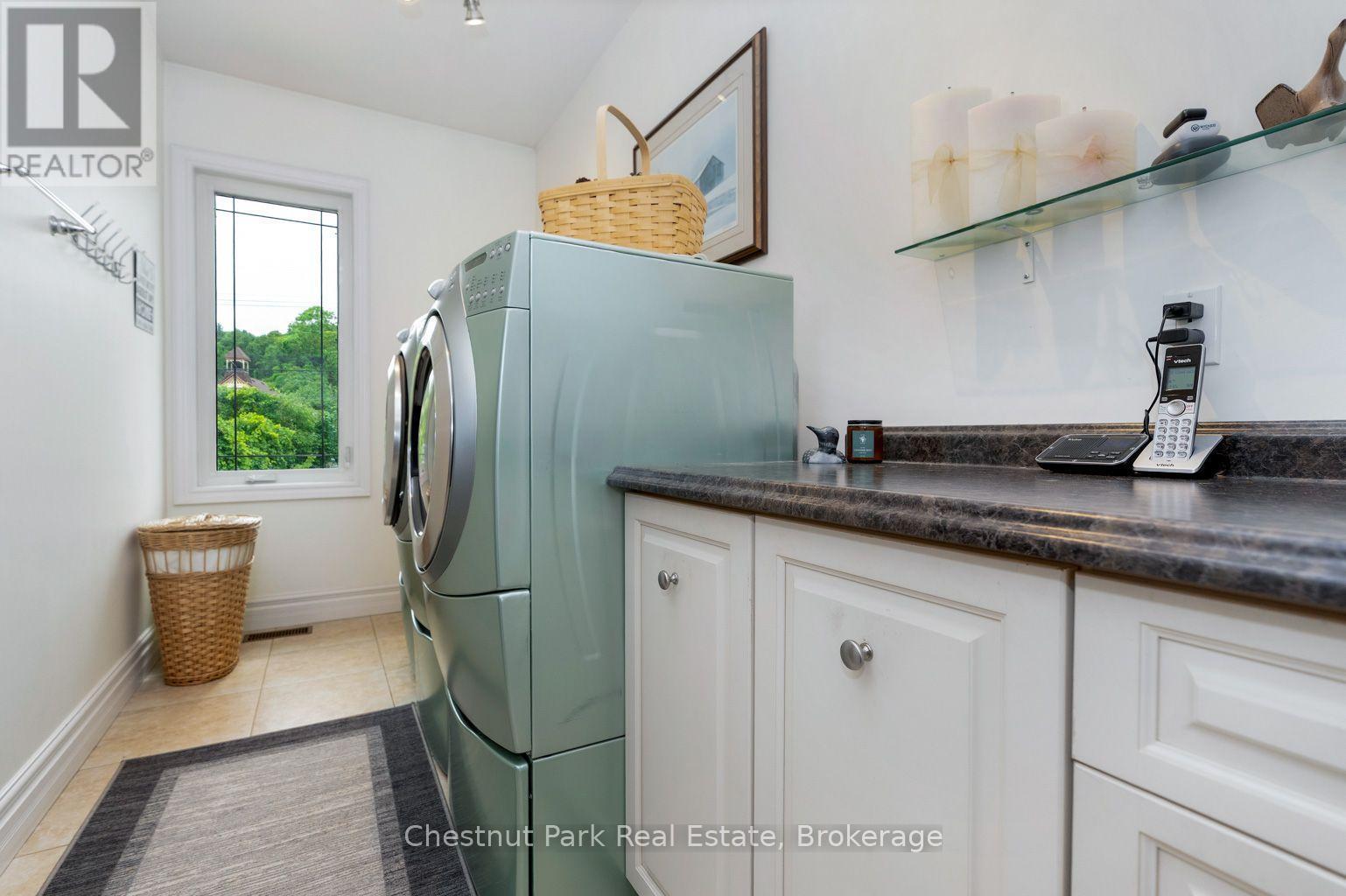main floor laundry - 133 Lakeshore Road E, Blue Mountains, ON - Indoor Photo Showing Laundry Room