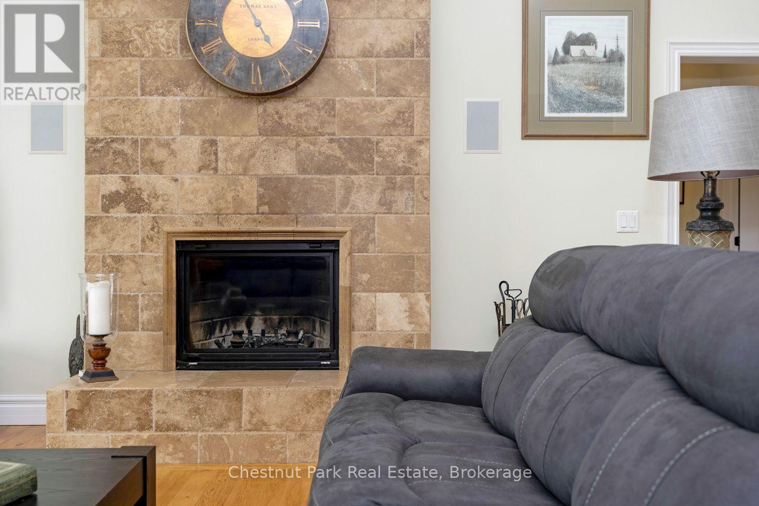 Wood burning fireplace - 133 Lakeshore Road E, Blue Mountains, ON - Indoor Photo Showing Living Room With Fireplace