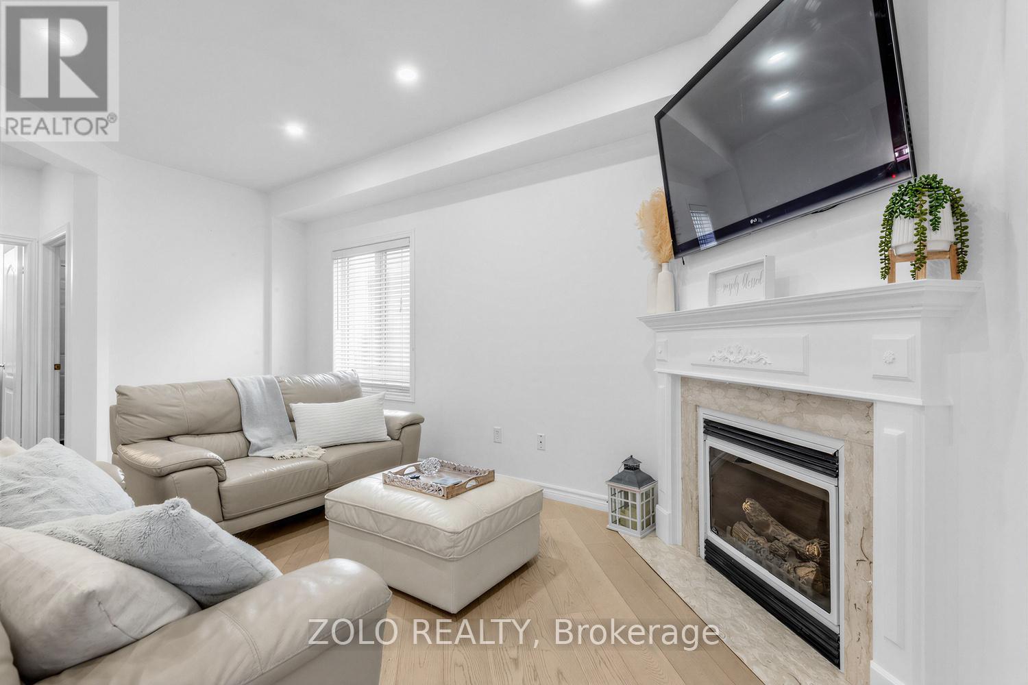 1911 Swan Street, Innisfil, ON - Indoor Photo Showing Living Room With Fireplace