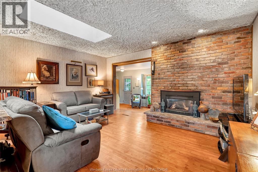1335 Laurier Drive, Lasalle, ON - Indoor Photo Showing Living Room With Fireplace