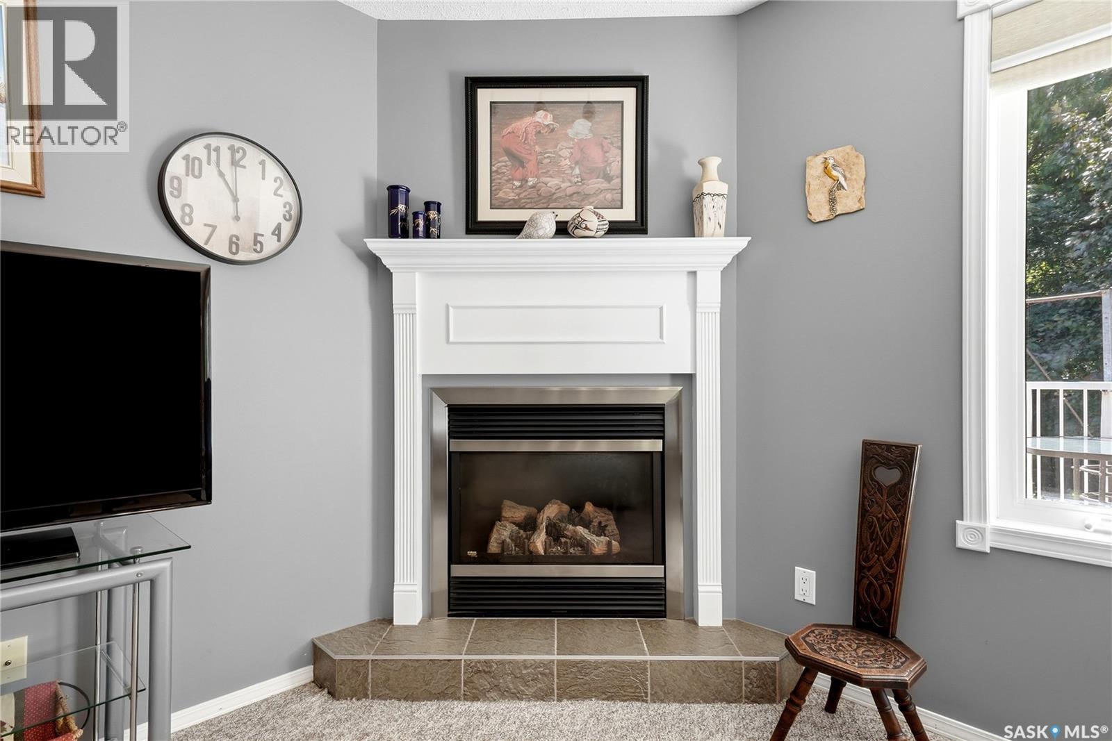 28 Rosedale Avenue, Katepwa Beach, SK - Indoor Photo Showing Living Room With Fireplace