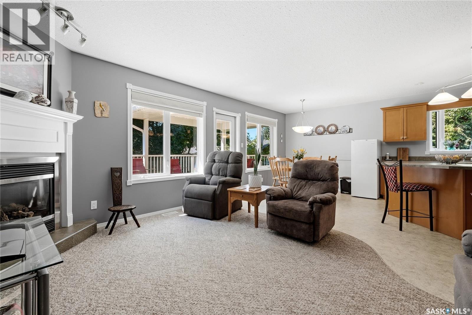 28 Rosedale Avenue, Katepwa Beach, SK - Indoor Photo Showing Living Room With Fireplace