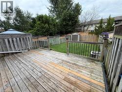 Expansive wooden deck with railing and balusters -