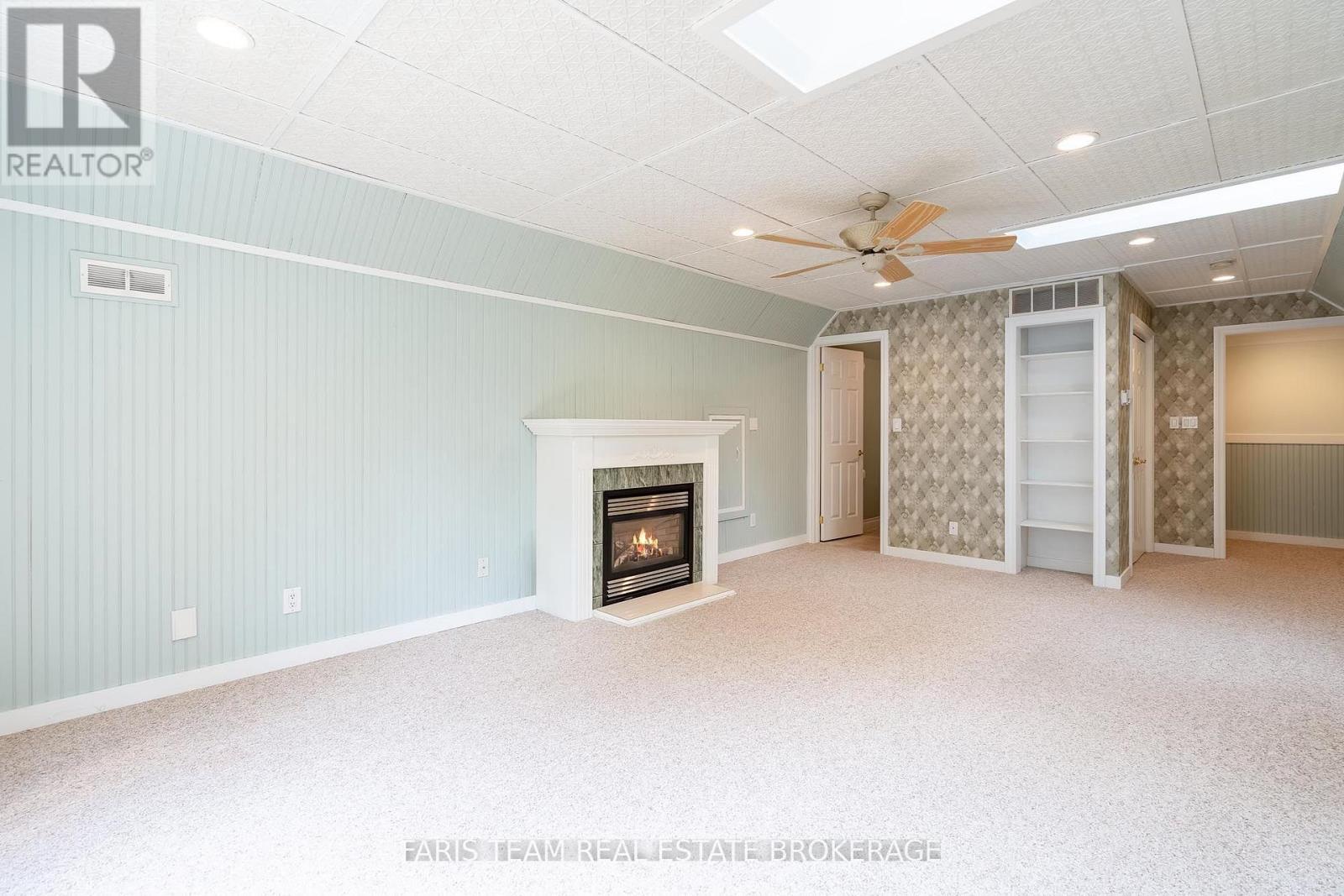 105 Copeland Creek Drive, Tiny, ON - Indoor With Fireplace
