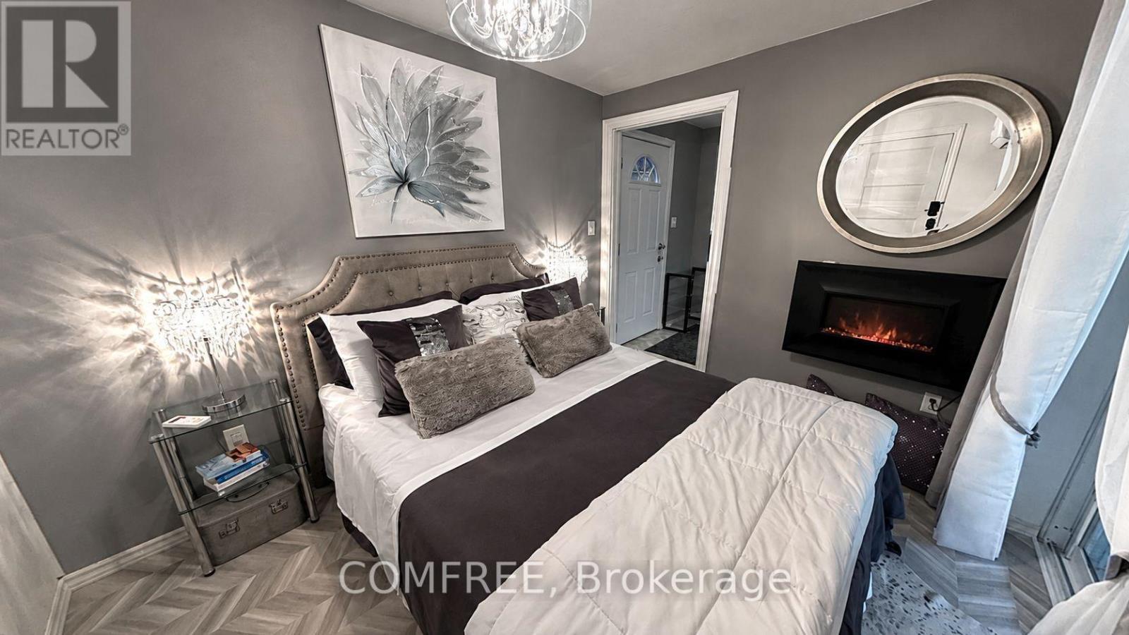 8950 Brown Road, Niagara Falls (Brown), ON - Indoor Photo Showing Bedroom With Fireplace