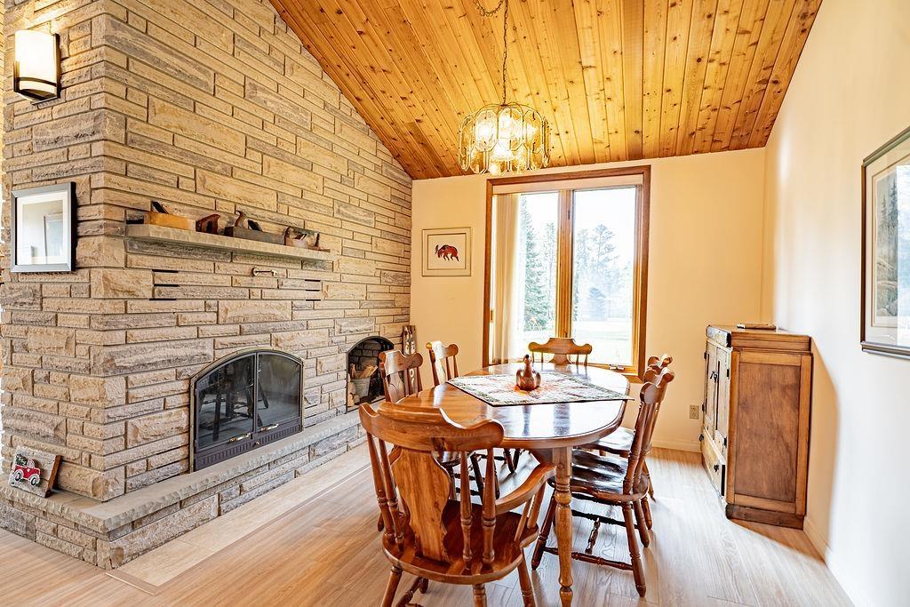 4600 Mapleward Rd., Thunder Bay, ON - Indoor Photo Showing Dining Room With Fireplace