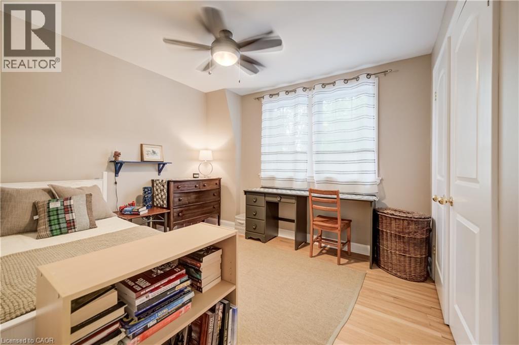 Bedroom featuring hardwood flooring, a ceiling fan, and painted walls - 314 Glasgow Street, Kitchener, ON - Indoor