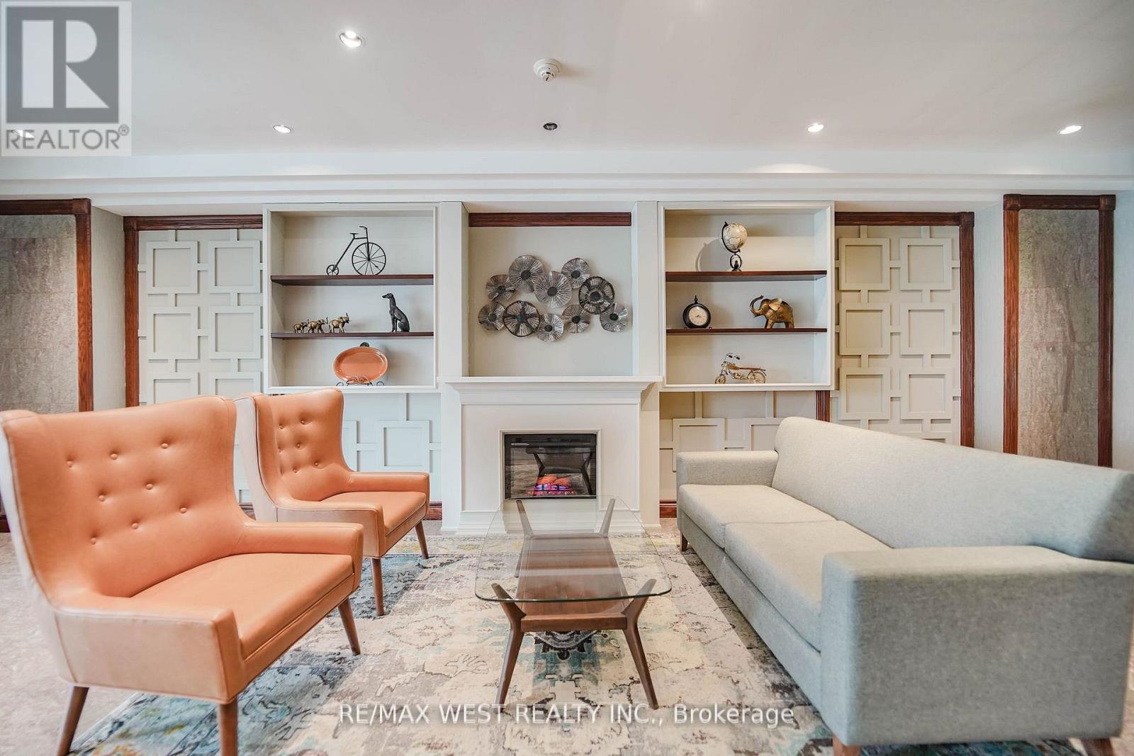 309 - 190 Manitoba Street, Toronto, ON - Indoor Photo Showing Living Room With Fireplace