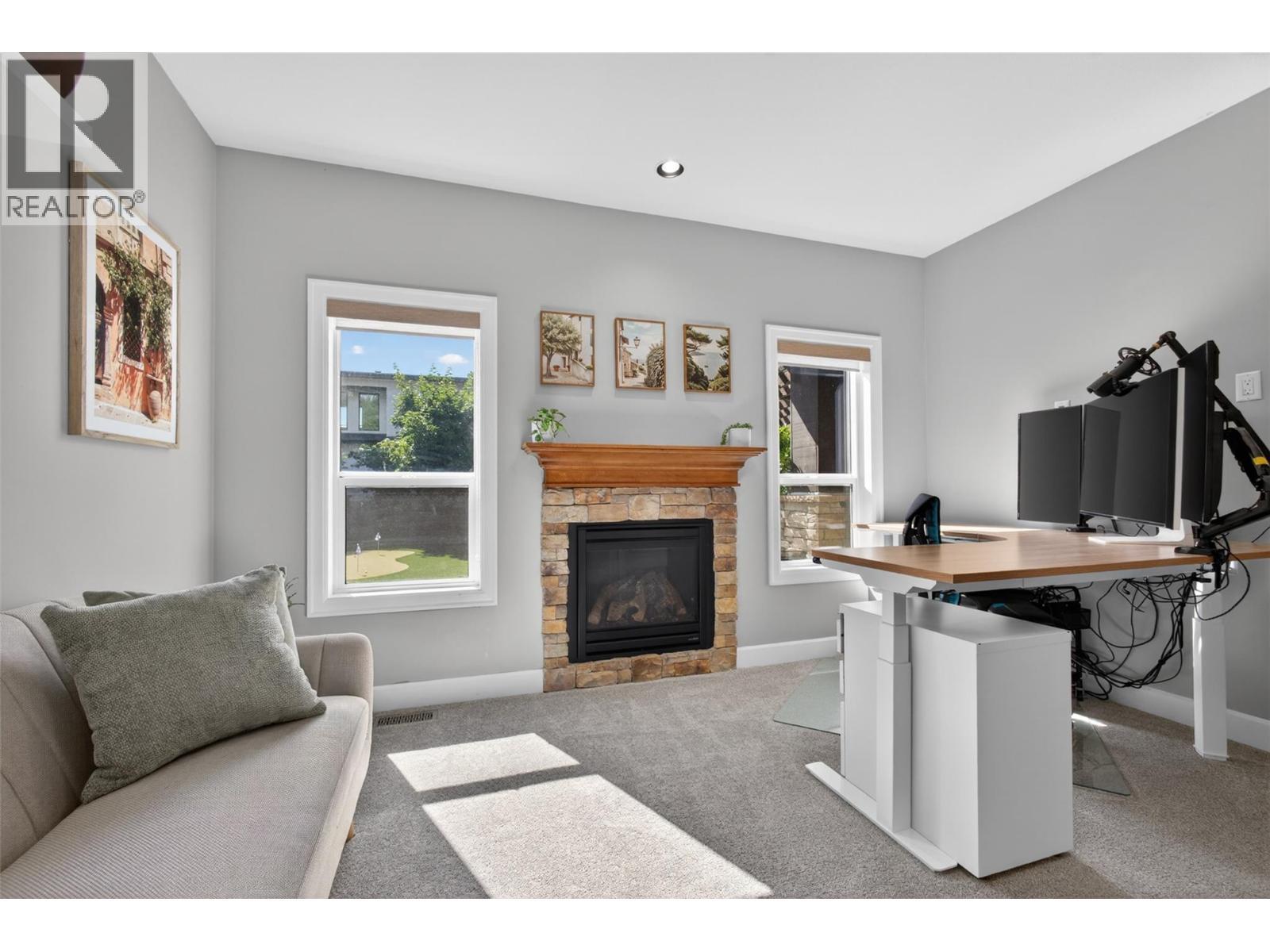 4588 Raymer Road, Kelowna, BC - Indoor Photo Showing Other Room With Fireplace