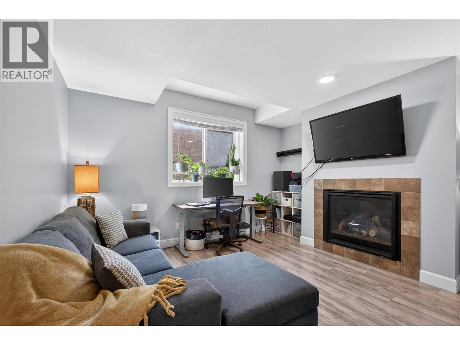 suite - 4588 Raymer Road, Kelowna, BC - Indoor Photo Showing Living Room With Fireplace