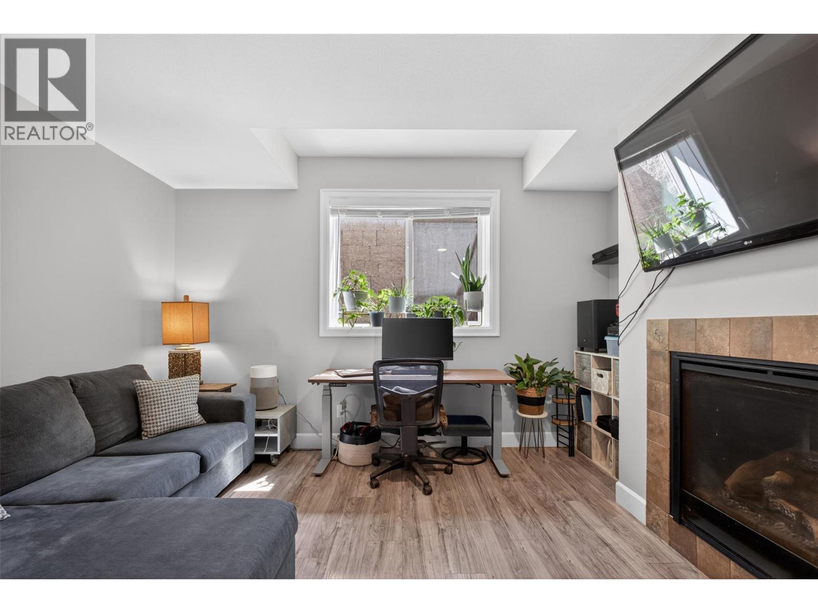 suite - 4588 Raymer Road, Kelowna, BC - Indoor Photo Showing Living Room With Fireplace