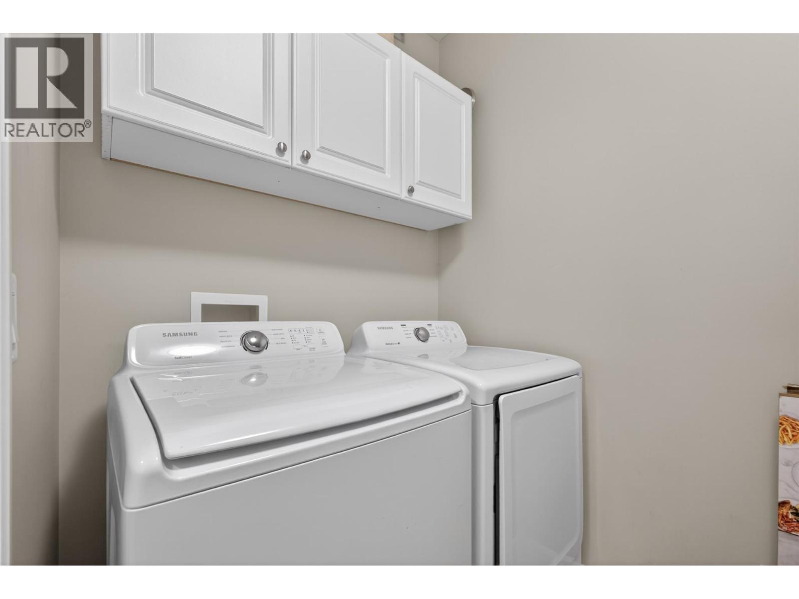 suite laundry - 4588 Raymer Road, Kelowna, BC - Indoor Photo Showing Laundry Room