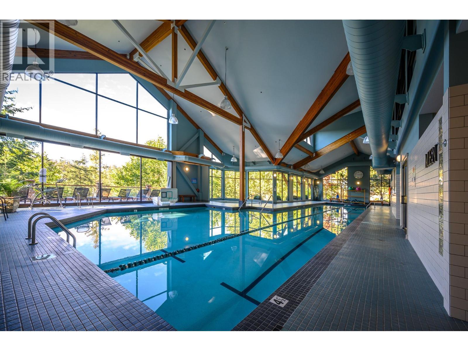 333 Longspoon Drive Unit# 19, Vernon, BC - Indoor Photo Showing Other Room With In Ground Pool