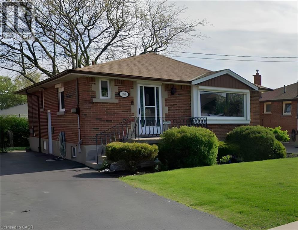 Brick exterior with a gabled roof and a large bay window - 781 Ninth Avenue Unit# Lower, Hamilton, ON - Outdoor