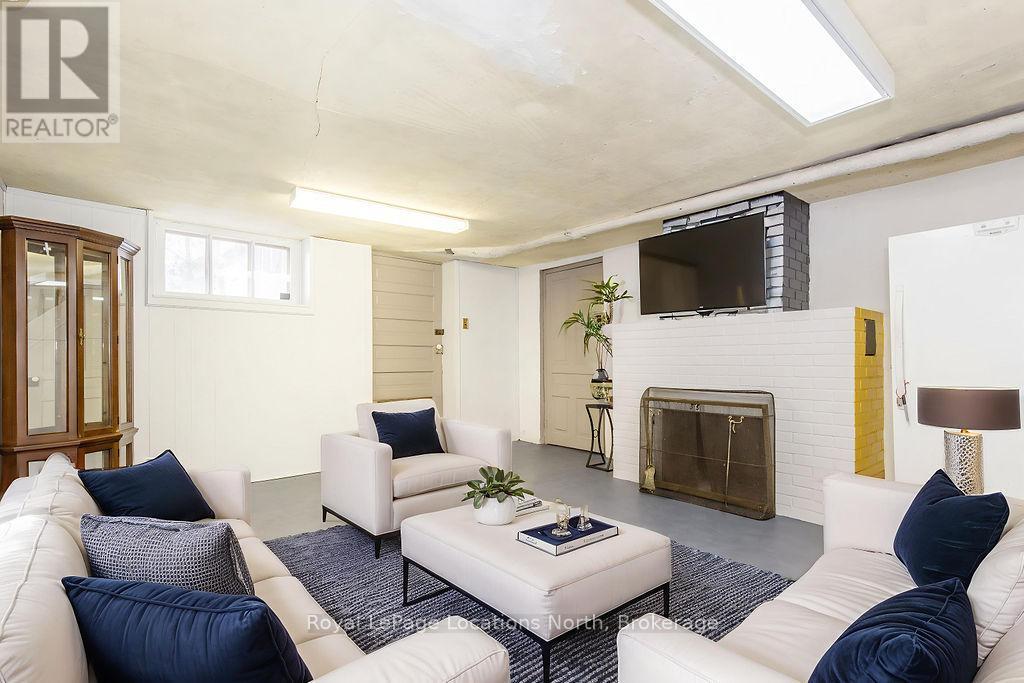 Virtually staged - 29 Tecumseth Street, Orillia, ON - Indoor Photo Showing Living Room With Fireplace