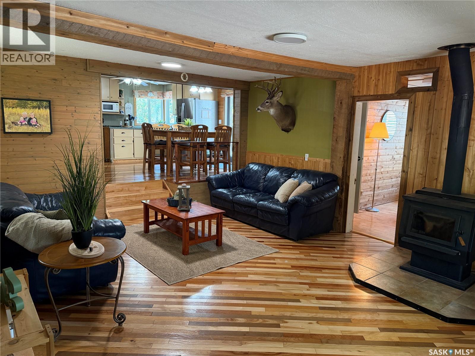 1306 Kewatin Lane, Turtle Lake, SK - Indoor Photo Showing Living Room With Fireplace