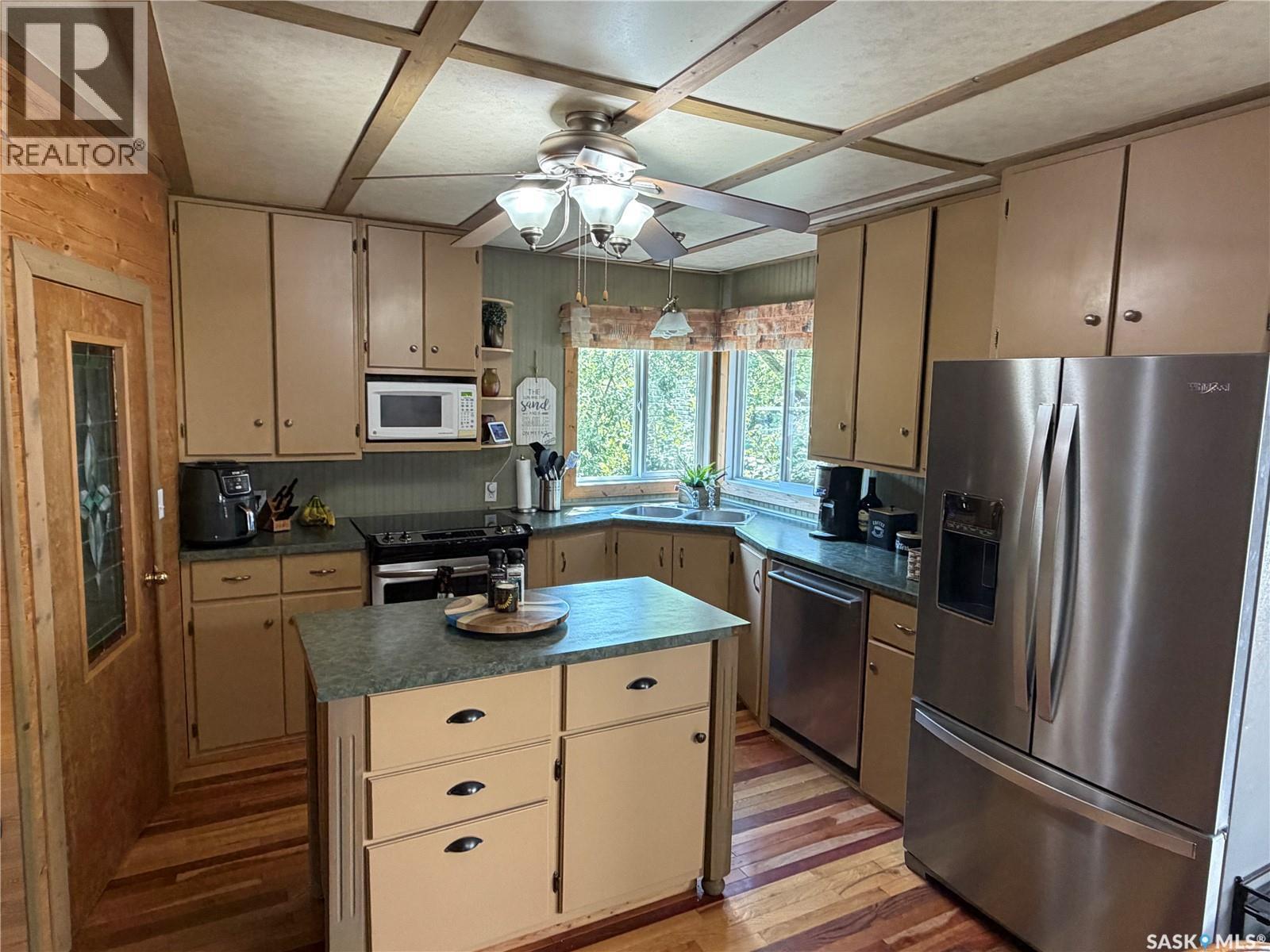 1306 Kewatin Lane, Turtle Lake, SK - Indoor Photo Showing Kitchen With Double Sink