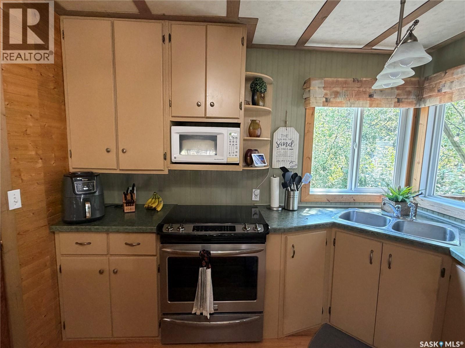 1306 Kewatin Lane, Turtle Lake, SK - Indoor Photo Showing Kitchen With Double Sink