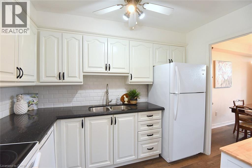 2263 Marine Drive Unit# 401, Oakville, ON - Indoor Photo Showing Kitchen With Double Sink