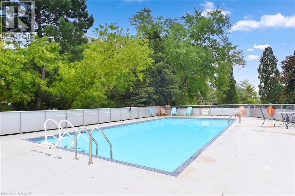 2263 Marine Drive Unit# 401, Oakville, ON - Outdoor With In Ground Pool With Backyard