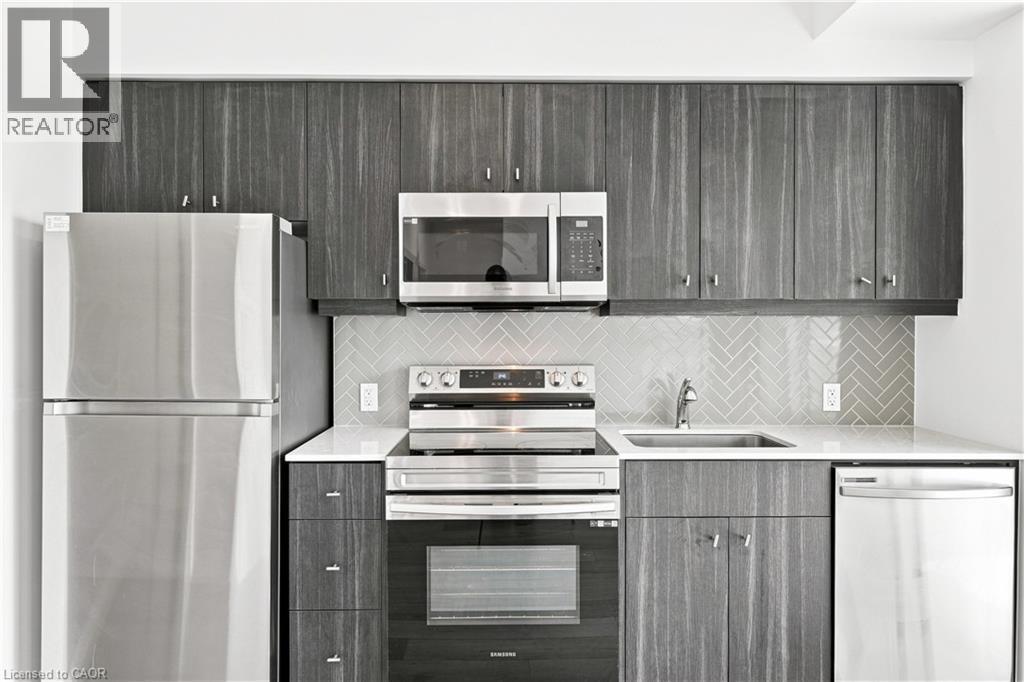 101 Golden Eagle Road Unit# 215, Waterloo, ON - Indoor Photo Showing Kitchen With Upgraded Kitchen