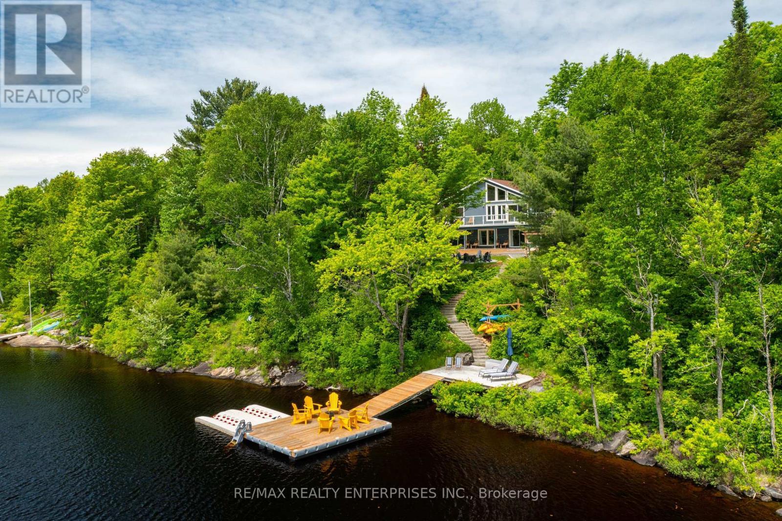 200ft of southwest shoreline on 1.26 private acres - 140 Rachels Lane, Huntsville, ON - Outdoor With Body Of Water