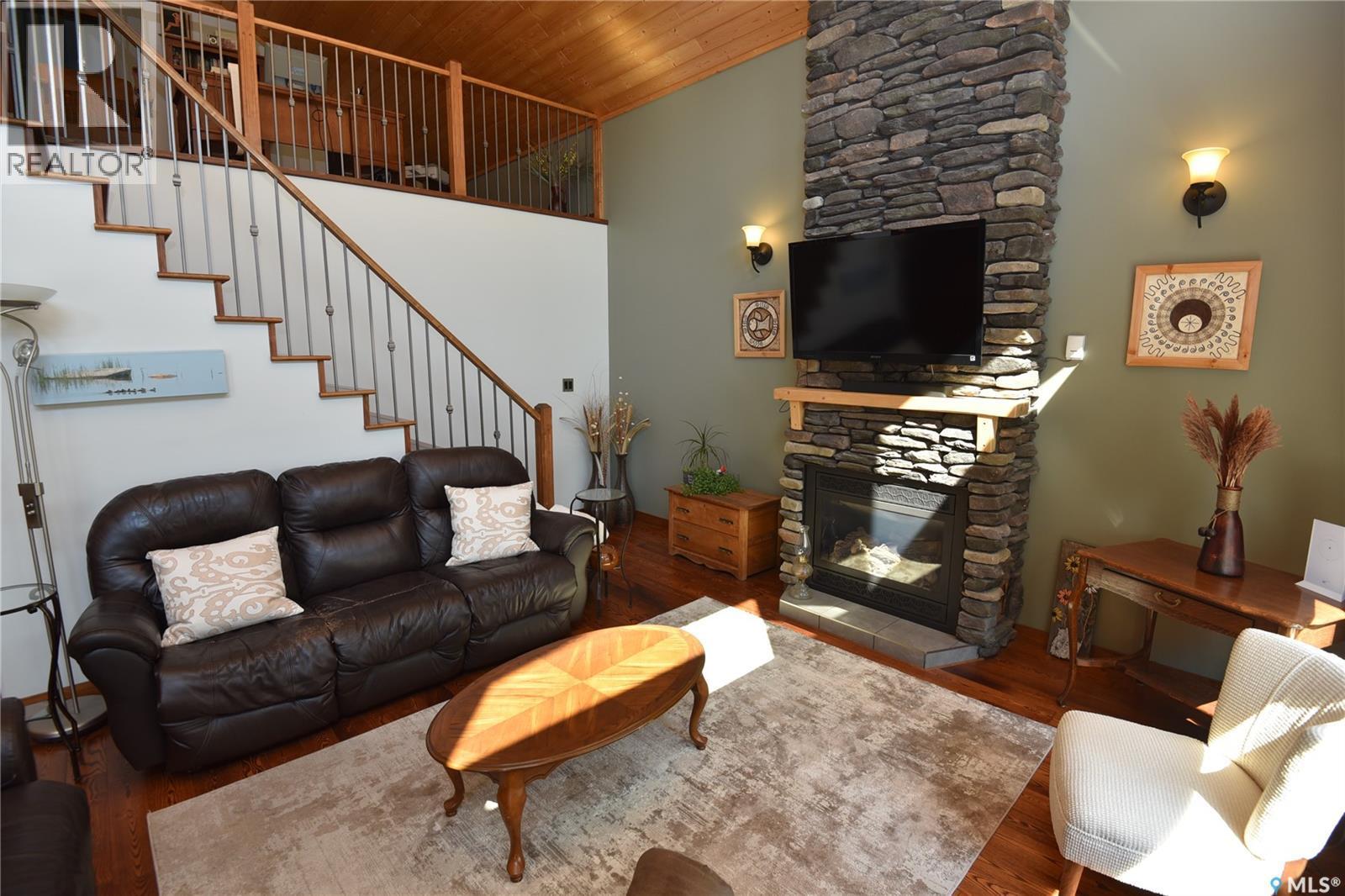 308 Park Drive, Tobin Lake, SK - Indoor Photo Showing Living Room With Fireplace