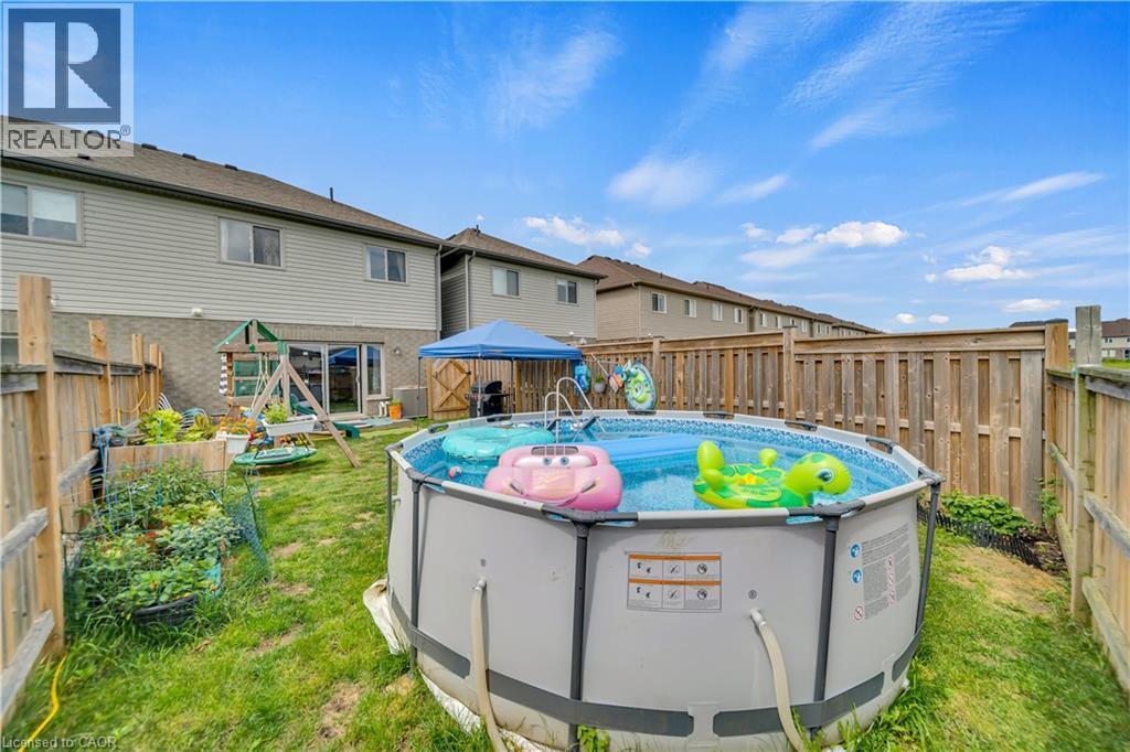 1450 Caen Avenue, Woodstock, ON - Outdoor With Above Ground Pool With Exterior