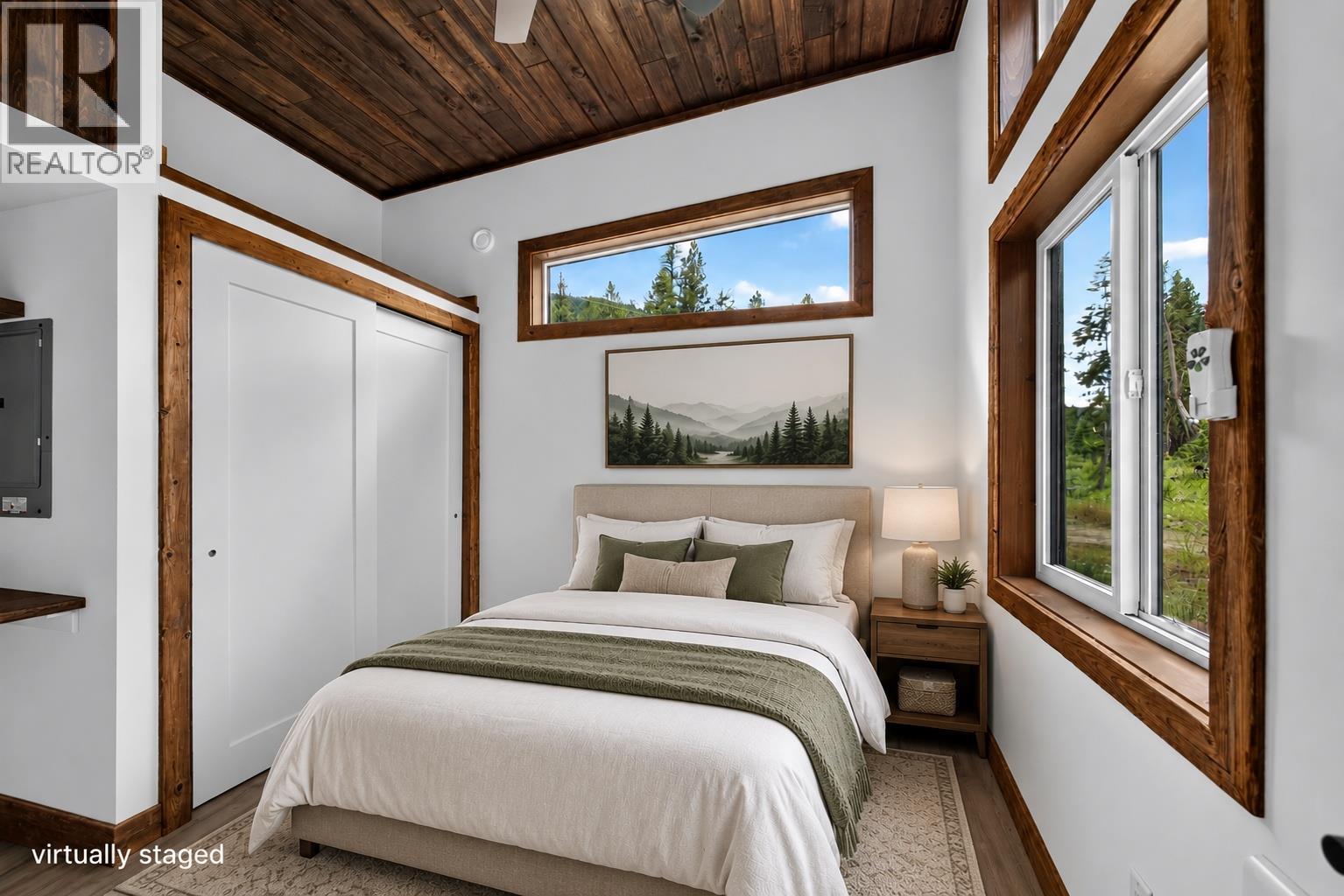 Virtually staged primary bedroom - 5533 33 Highway Unit# 1, Beaverdell, BC