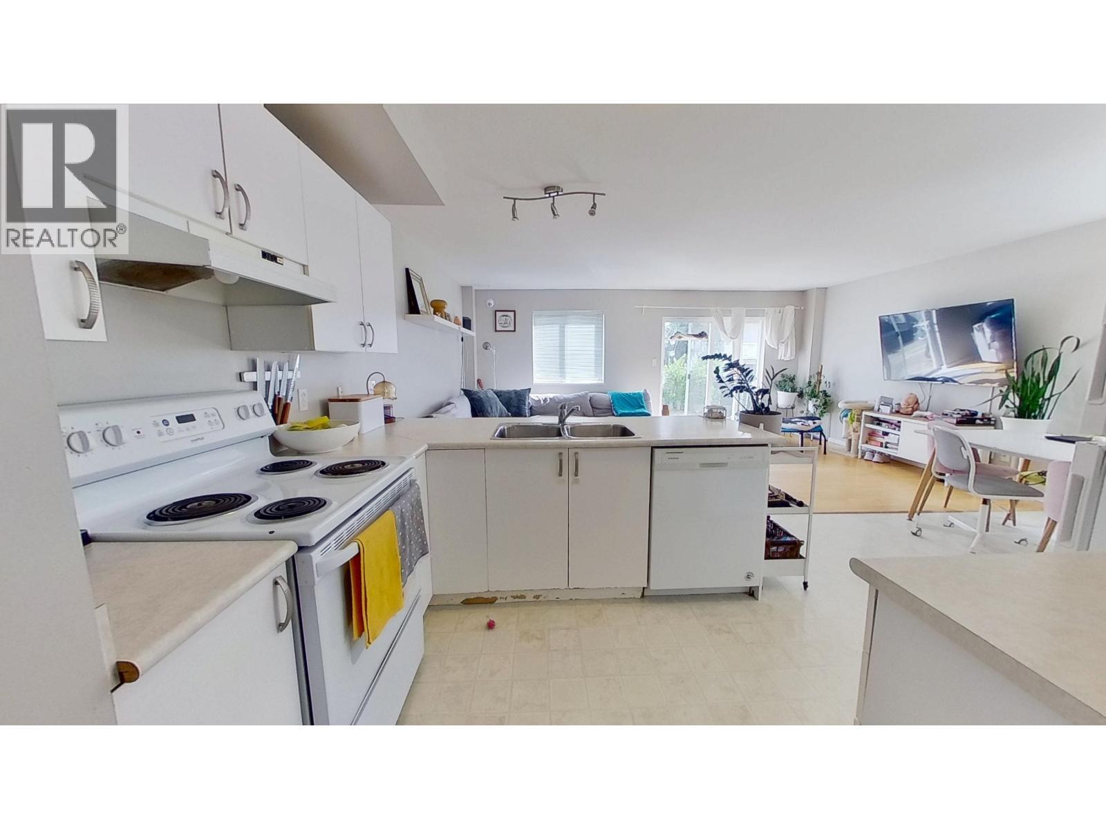 9703 93 Street, Fort St. John, BC - Indoor Photo Showing Kitchen With Double Sink