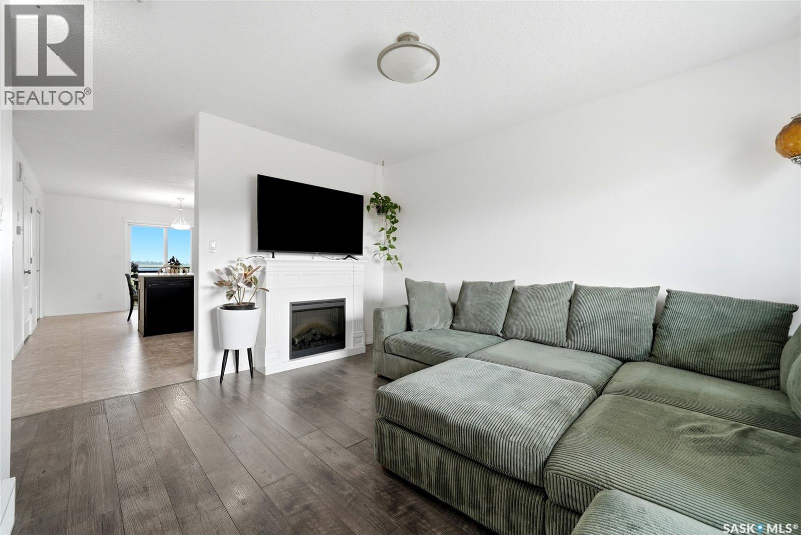 312 3822 Dewdney Avenue E, Regina, SK - Indoor Photo Showing Living Room With Fireplace