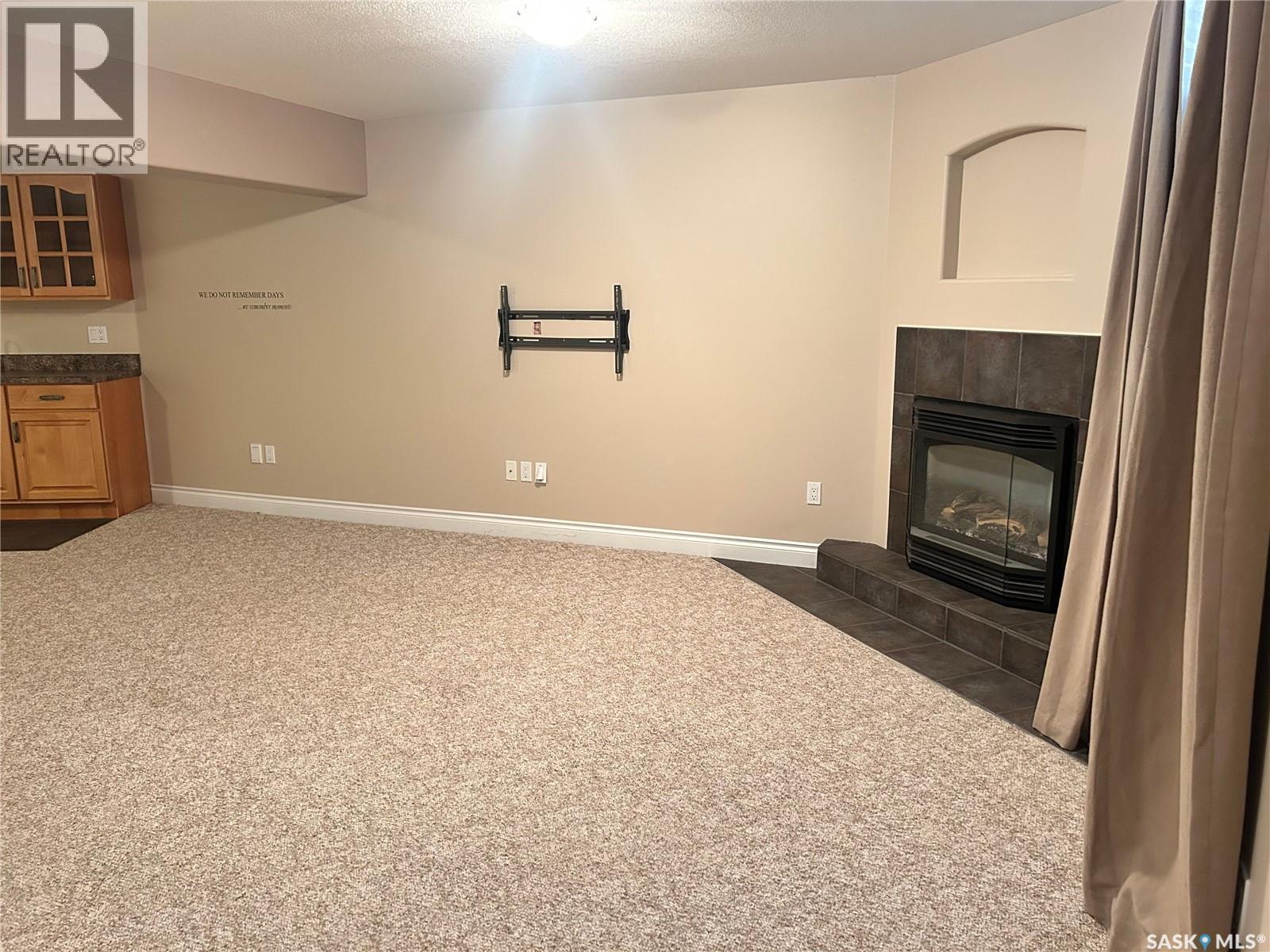 1 Telfer Bay, Prince Albert, SK - Indoor With Fireplace