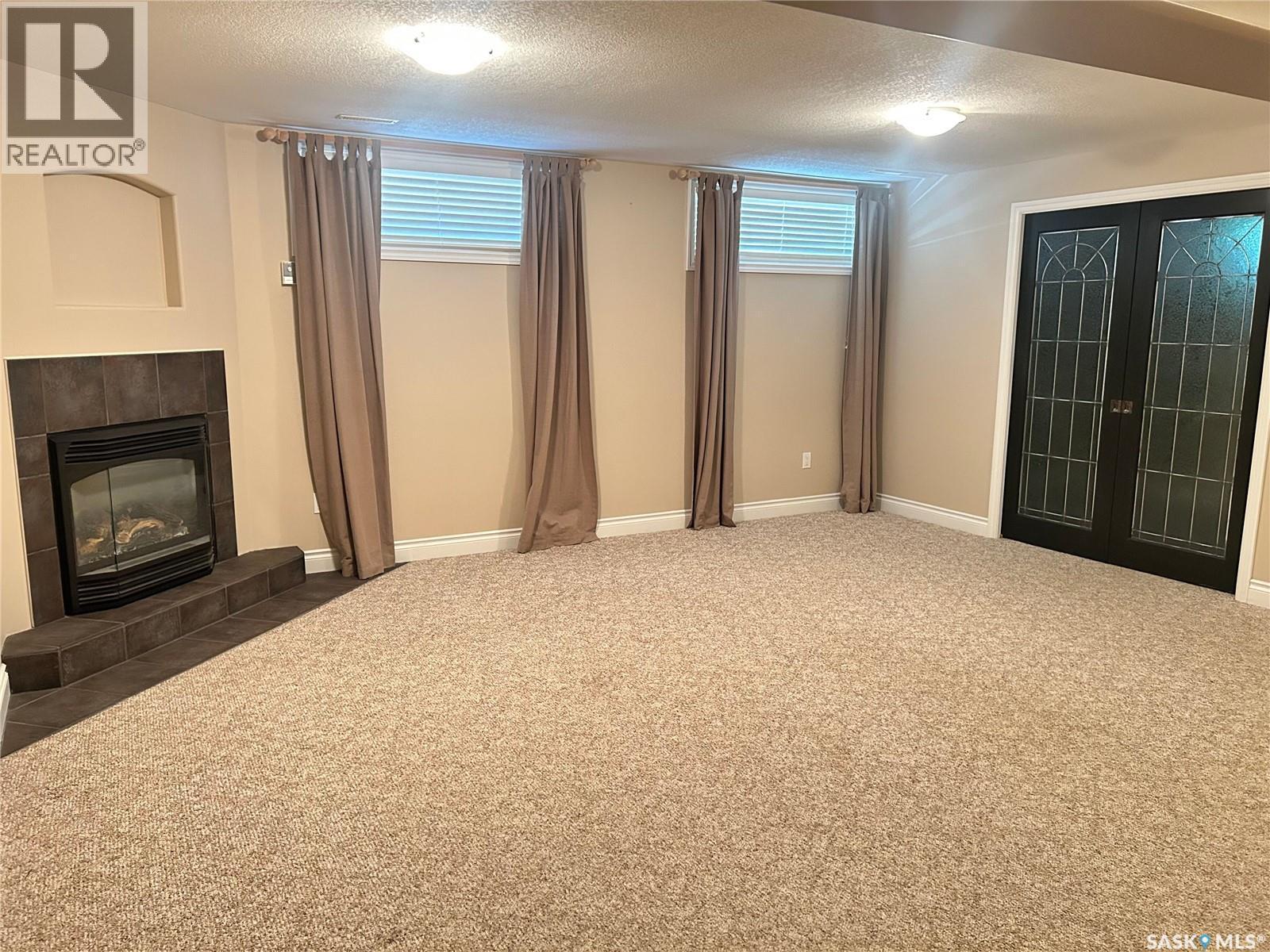 1 Telfer Bay, Prince Albert, SK - Indoor With Fireplace