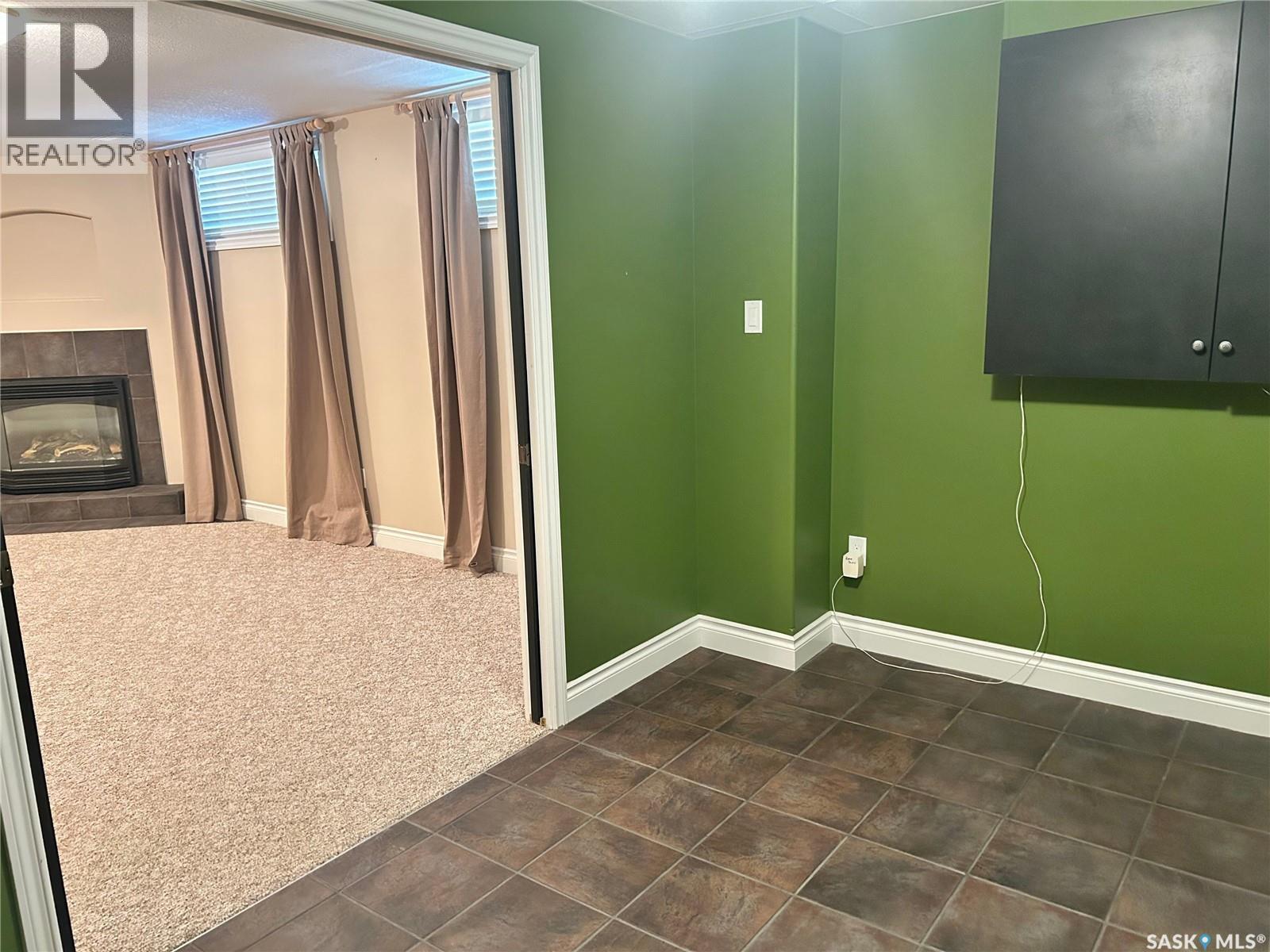 1 Telfer Bay, Prince Albert, SK - Indoor Photo Showing Other Room With Fireplace