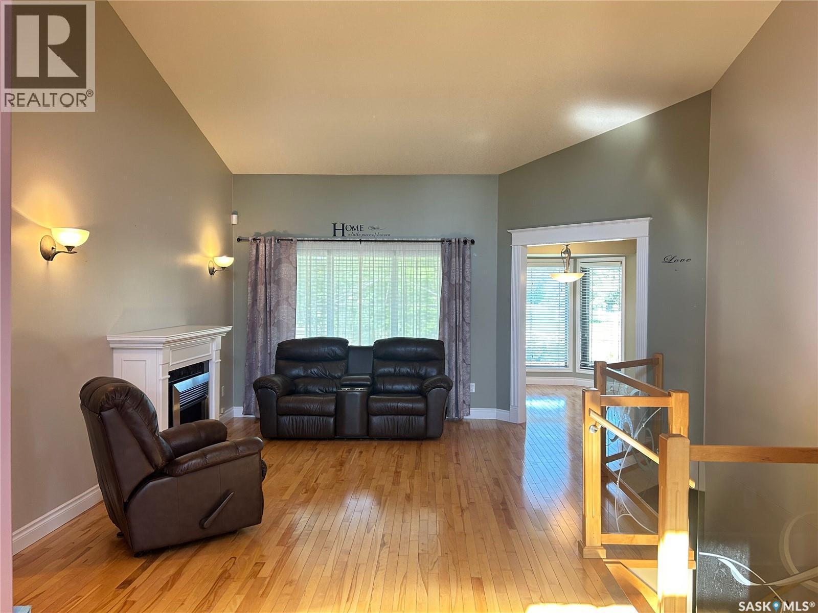 1 Telfer Bay, Prince Albert, SK - Indoor Photo Showing Living Room With Fireplace